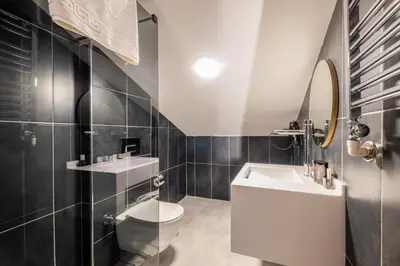a bathroom with a white toilet and a sink at 216 Bosphorus Suite in Istanbul