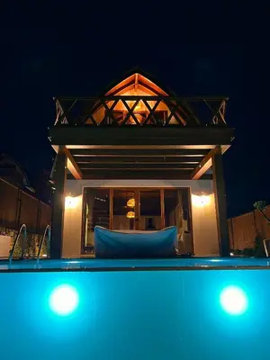 a house with a swimming pool at night at Exclusive Hill Sapanca in Sapanca