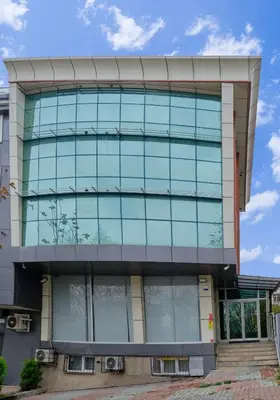 an office building with glass windows at Daire 1 Jakuzili in Beylikduzu
