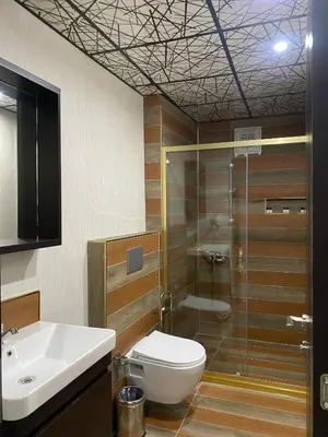 a bathroom with a toilet and a shower and a sink at Grand Armada Hotel in Avcılar