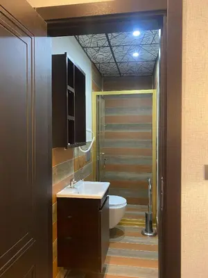 a bathroom with a white toilet and a sink at Grand Armada Hotel in Avcılar