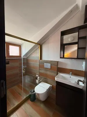 a bathroom with a toilet and a sink at Grand Armada Hotel in Avcılar