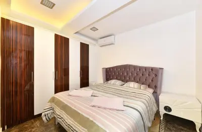 a bedroom with a bed with pink towels on it at Castle Suite in Istanbul
