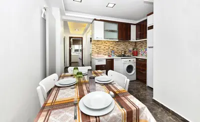 a kitchen and dining room with a table and chairs at Castle Suite in Istanbul