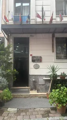 a front entrance to a building with a sign on it at Hotel Almina İnn in Istanbul