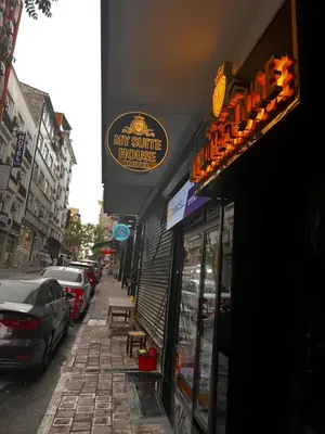 a sign for my shuttle house on a city street at Hotel Almina İnn in Istanbul