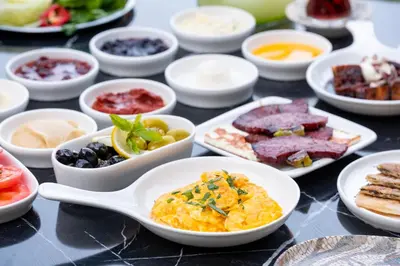 a table topped with bowls of different types of food at Backyard Sapanca in Sapanca
