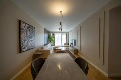 a dining room with a long table and chairs at Taksim Petek Residence by Guestteori in Istanbul