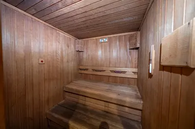 a sauna with wooden walls and a wooden floor at Taksim Petek Residence by Guestteori in Istanbul