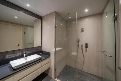 a bathroom with a sink and a glass shower at Taksim Petek Residence by Guestteori in Istanbul