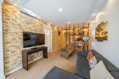 a living room with a couch and a tv at Taksim Petek Residence by Guestteori in Istanbul