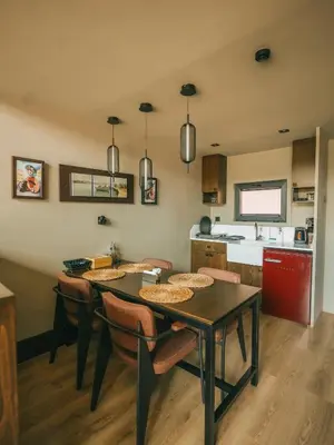 a kitchen and dining room with a table and chairs at Casa Vera Villa in Sakarya