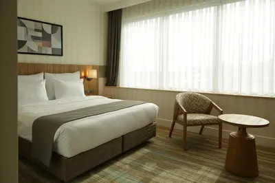 a hotel room with a bed and a chair at Tress Hotel in Istanbul