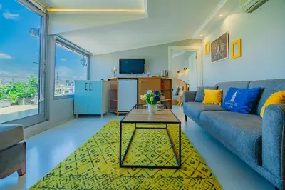 a living room with a couch and a table at Galata Nil Suite in Istanbul