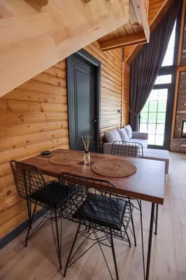a dining room with a table and chairs at MSC Bungalov Sapanca in Sapanca