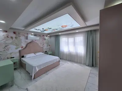 a bedroom with a large bed and a large window at Daly Resort 2 in Sapanca