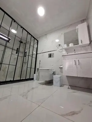 a white bathroom with a toilet and a sink at Daly Resort 2 in Sapanca