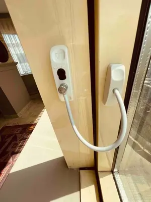 a cord hooked up to a phone on a wall at Country , two bedroom and livingroom on Main Street in Çekmeköy