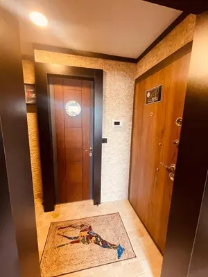 a hallway with a door and a rug at Retro, two bedroom and livingroom on Main Street in Çekmeköy
