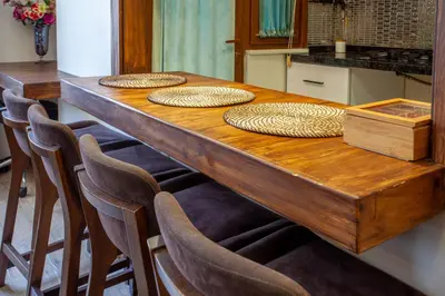 a long wooden table with four chairs around it at Mutlu flat in Istanbul