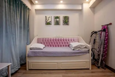 a bedroom with a bed with a pink headboard at Super house 75 mt 2 bedrooms 1 living room Istanbul center in Istanbul