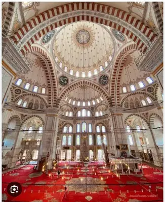 a large building with a large ceiling with a clock at Super house 75 mt 2 bedrooms 1 living room Istanbul center in Istanbul