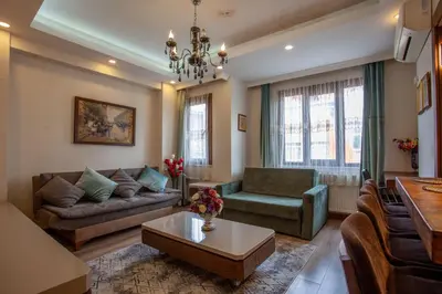 a living room with a couch and a table at Super house 75 mt 2 bedrooms 1 living room Istanbul center in Istanbul