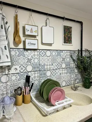 a kitchen counter with a dish rack with plates on it at Stylish Triplex with Turkish Bath, Terrace, Central Location in Istanbul