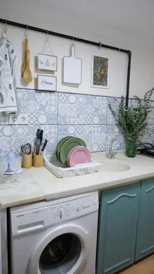 a kitchen counter with a washing machine and a sink at Stylish Triplex with Turkish Bath, Terrace, Central Location in Istanbul