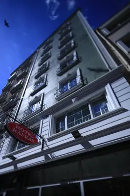 a tall building with a stop sign in front of it at Kafkas Hotel Istanbul in Istanbul