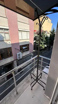 an umbrella on the balcony of a building at Golden Wood Suites in Istanbul