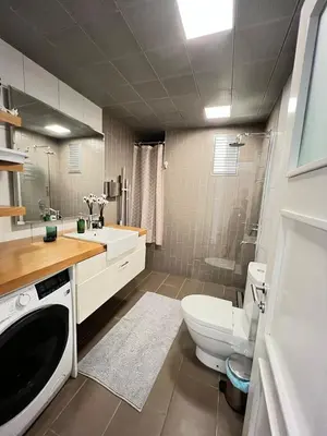 a bathroom with a toilet sink and a washing machine at Central Apartment Close to Galataport in Istanbul