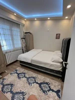 a bedroom with a bed and a blue ceiling at Mutlu terrace in Istanbul