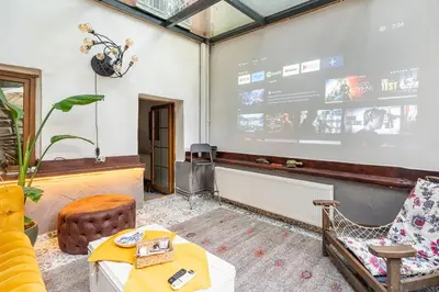 a room with a stage with a table and chairs at House of Soul & Triplex with a Winter Garden in Istanbul