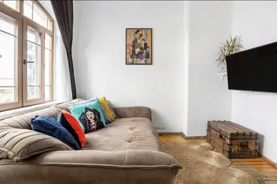 a living room with a brown couch in a room at House of Soul & Triplex with a Winter Garden in Istanbul