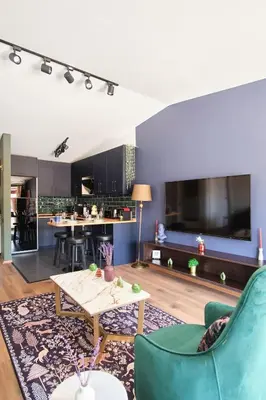 a living room with a couch and a table at Cozy Penthouse with the Balcony in Istanbul