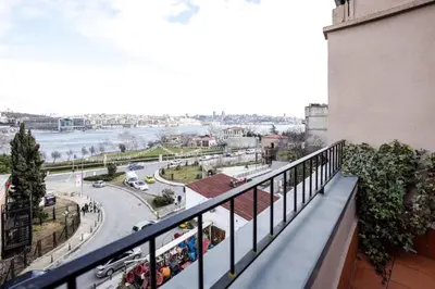 a balcony of a building with a view of a street at Stunning New Balat Water Front Pad! #383 in Istanbul