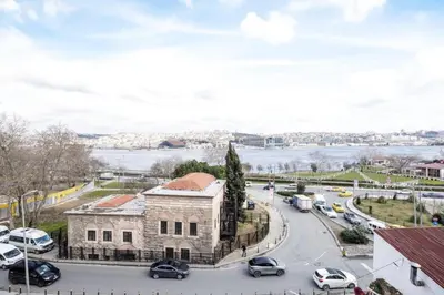 a city street with cars parked on the road at Stunning New Balat Water Front Pad! #383 in Istanbul