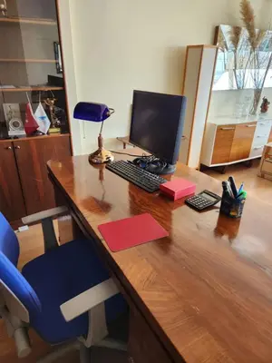 a desk with a computer and a blue chair at Stunning 1BR w Sea View close to Galataport ! in Istanbul