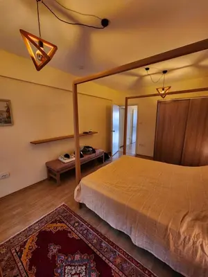 a bedroom with a large bed and a rug at Stunning 1BR w Sea View close to Galataport ! in Istanbul