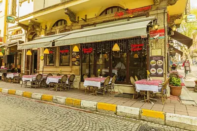 a restaurant with tables and chairs outside of a building at Hotel Spectra Sultanahmet in Istanbul