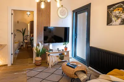 a living room with a large window and a tv at Rum Otto Enjoy Relax 30 sec to Taksim Bathtub in Istanbul