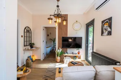 a living room with a couch and a tv at Rum Otto Enjoy Relax 30 sec to Taksim Bathtub in Istanbul