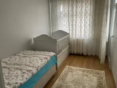 a small bedroom with a bed and a window at Three-room private apartment in Beyoğlu, Central Istanbul in Istanbul