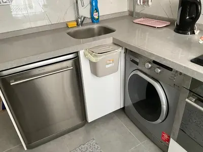 a kitchen with a sink and a washing machine at Three-room private apartment in Beyoğlu, Central Istanbul in Istanbul