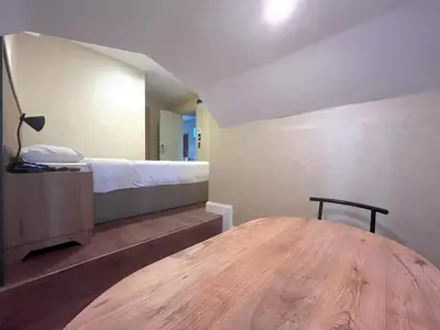 a room with a bed and a wooden table at Valens Butik in Istanbul