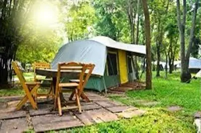 a tent with a table and chairs in front of it at NZR KAmP in Serdivan