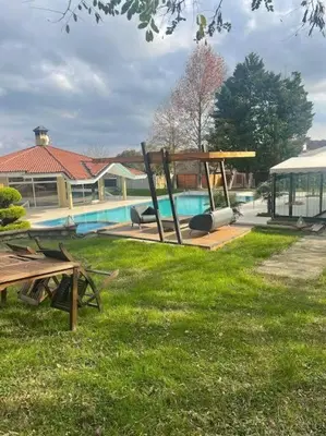 a yard with a pool and a swing at Synosse Park Hotel in Istanbul