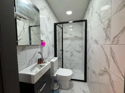 a bathroom with a sink and a toilet and a shower at Premium Palace in Istanbul