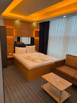 a hotel room with a bed and a couch at Premium Palace in Istanbul